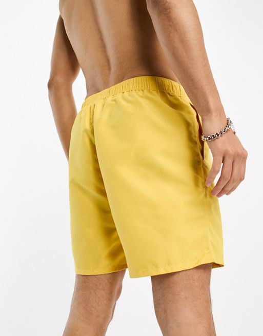 ASOS DESIGN swim shorts in short length with thick waistband in yellow