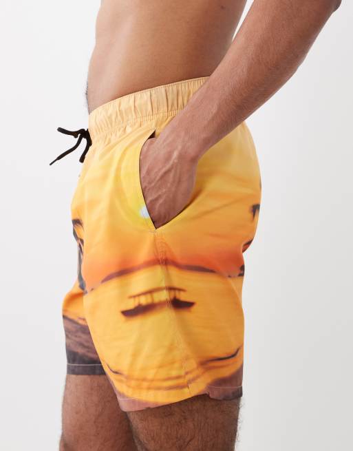 ASOS DESIGN swim shorts in mid length with beach sunset print in orange, 2 of 5