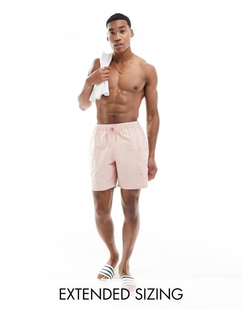 ASOS DESIGN swim shorts in mid length with cargo pocket in pink