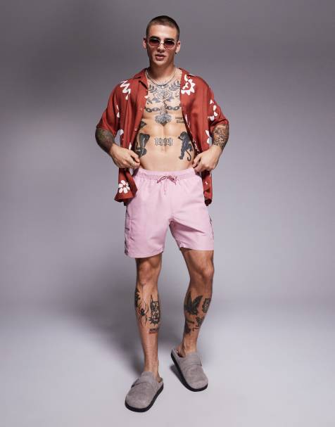 ASOS DESIGN swim shorts in mid length with cargo pockets in pink - view 1
