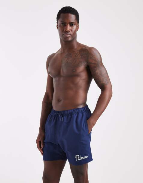 ASOS DESIGN swim shorts in mid length with embroidery in navy