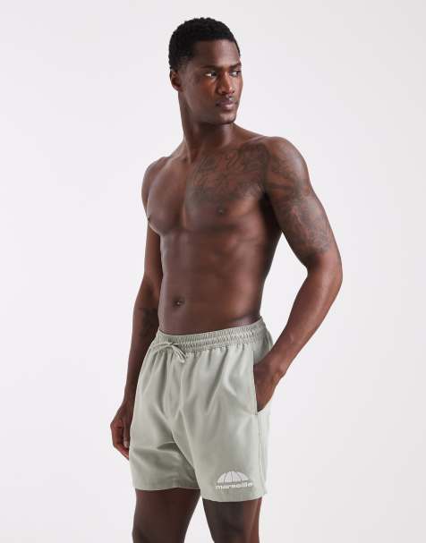 ASOS DESIGN swim shorts in mid length with embroidery in sage green - view 1
