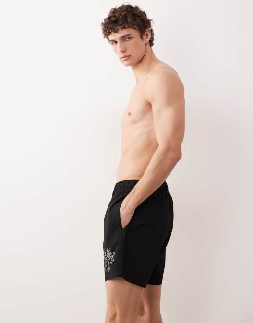 ASOS DESIGN swim shorts in mid length with floral placement print in black, 2 of 5