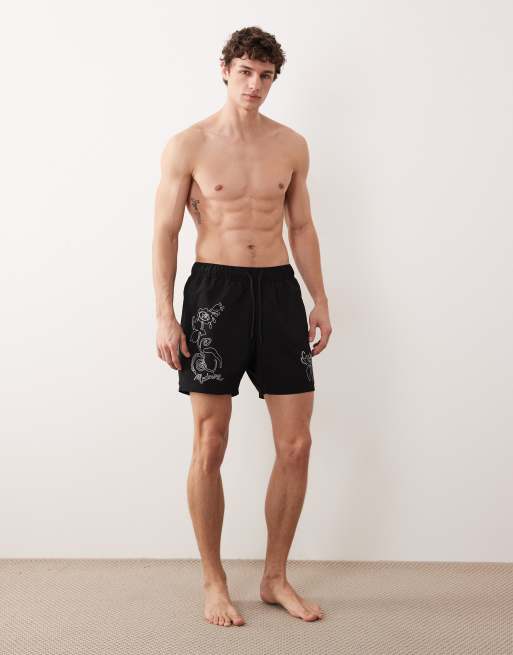 ASOS DESIGN swim shorts in mid length with floral placement print in black, 3 of 5