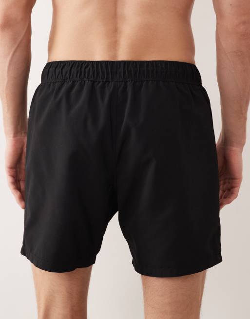 ASOS DESIGN swim shorts in mid length with floral placement print in black, 5 of 5