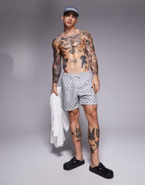 ASOS DESIGN swim shorts in mid length with geo print in blue - view 1