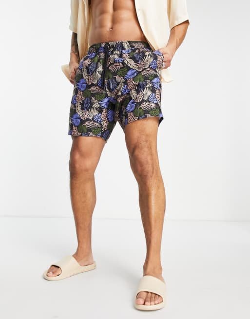 ASOS DESIGN swim shorts in mid length with leaf print in black