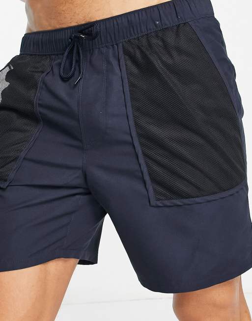 ASOS DESIGN swim shorts in mid length with mesh pockets in navy