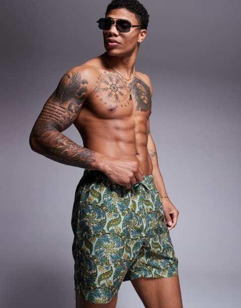ASOS DESIGN swim shorts in mid length with paisley print in sage - view 1