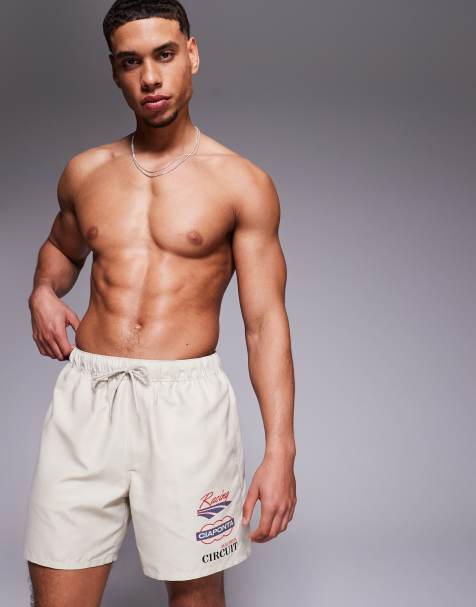ASOS DESIGN swim shorts in mid length with placement print in beige - view 1