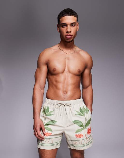 ASOS DESIGN swim shorts in mid length with placement print in beige