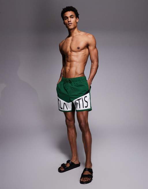 ASOS DESIGN swim shorts in mid length with placement print in green, 2 of 5