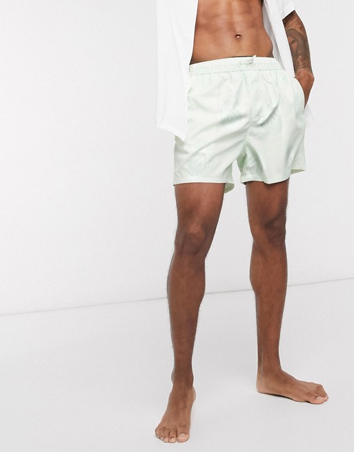 ASOS DESIGN swim shorts in mint green with paisley print short length