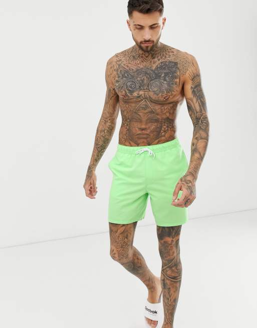 ASOS DESIGN swim shorts in neon green mid length ASOS