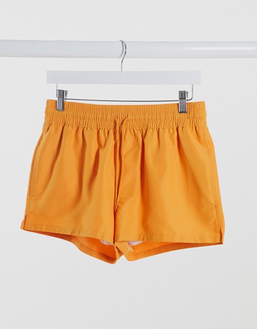 ASOS DESIGN swim shorts in orange in super short length