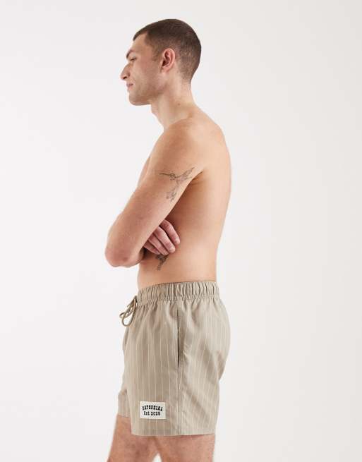 ASOS DESIGN swim shorts in short length in beige stripe with badge, 3 of 5