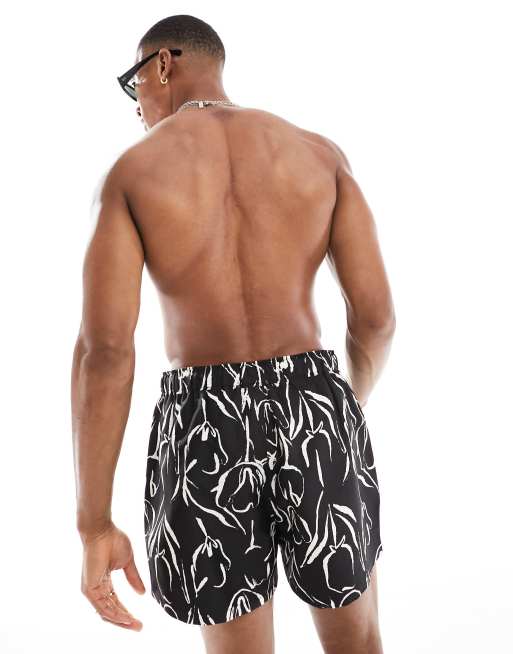 ASOS DESIGN swim shorts in short length in black