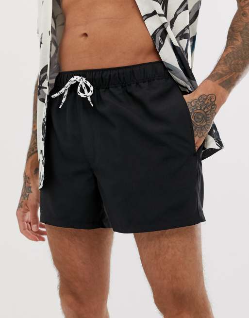 ASOS DESIGN swim shorts in short length in black