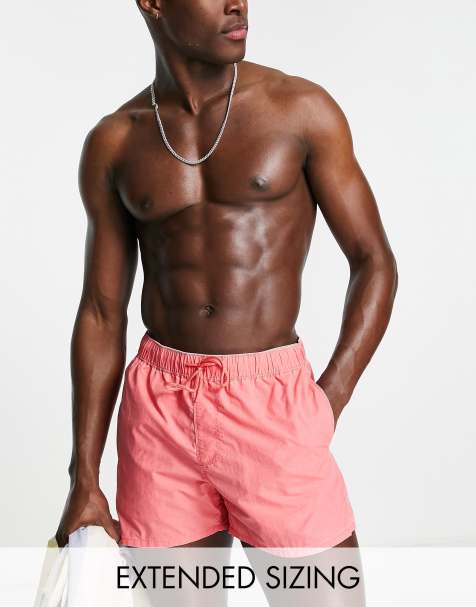 ASOS DESIGN swim shorts in short length in bright pink acid wash - view 1