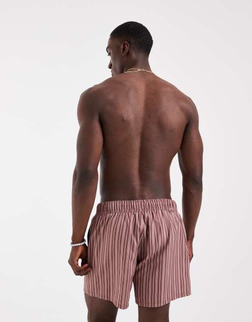 ASOS DESIGN swim shorts in short length in brown with white pattern stripe, 4 of 5