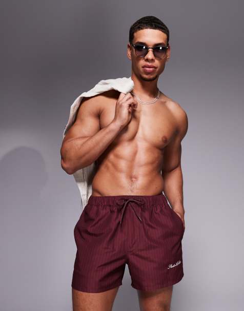 ASOS DESIGN swim shorts in short length in burgundy stripe with placement print - view 1