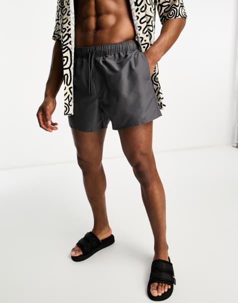 ASOS DESIGN swim shorts in short length in charcoal - view 1