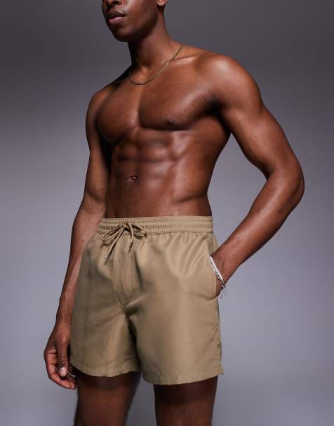 ASOS DESIGN swim shorts in short length in dark stone - view 1
