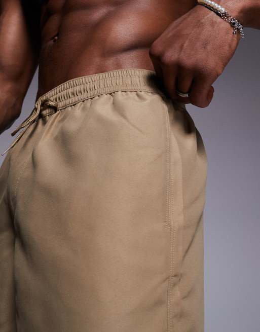ASOS DESIGN swim shorts in short length in dark stone
