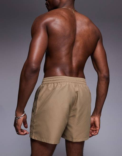 ASOS DESIGN swim shorts in short length in dark stone