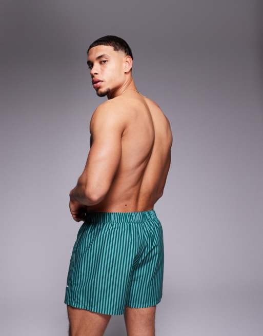 ASOS DESIGN swim shorts in short length in green stripe with placement print, 4 of 4