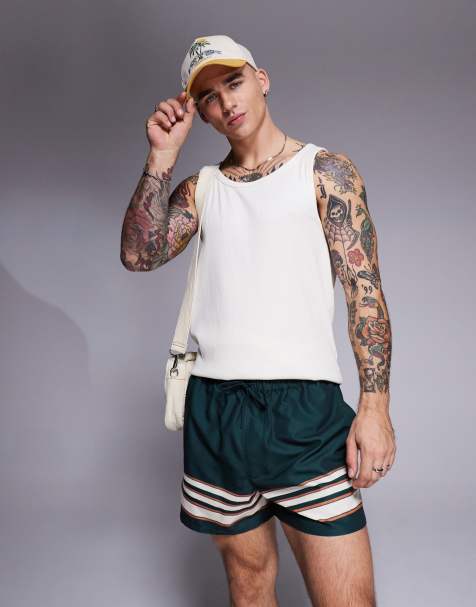 ASOS DESIGN swim shorts in short length in green with border stripe - view 1