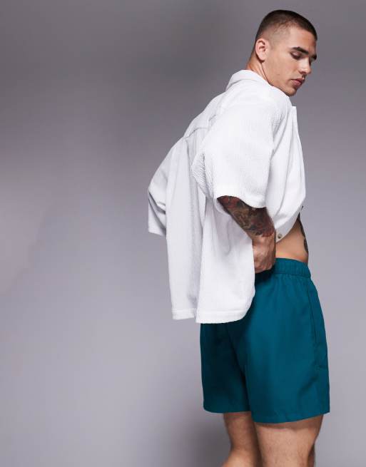 ASOS DESIGN swim shorts in short length in green, 3 of 4