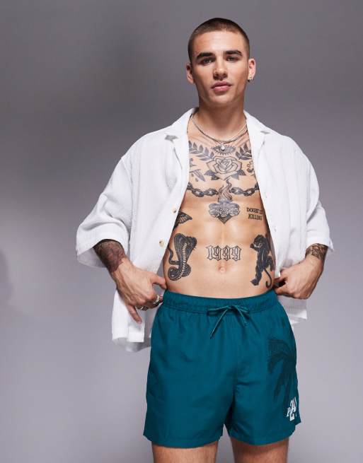 ASOS DESIGN swim shorts in short length in green, 4 of 4