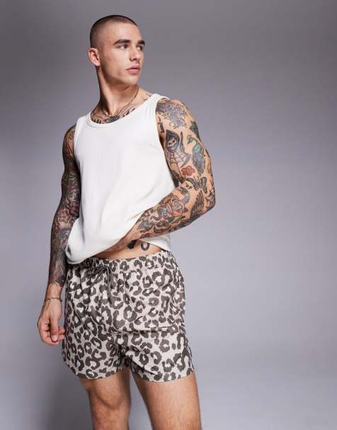 ASOS DESIGN swim shorts in short length in leopard print - view 1