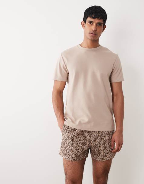 ASOS DESIGN swim shorts in short length in micro print in brown - view 1