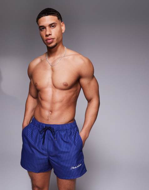 ASOS DESIGN swim shorts in short length in navy stripe with placement print - view 1
