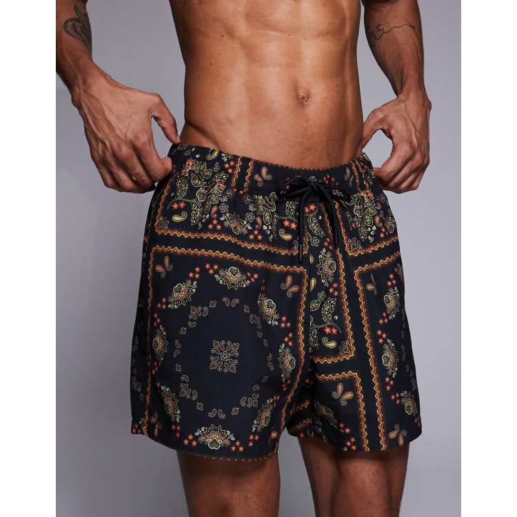 ASOS DESIGN swim shorts in short length in paisley bandana print