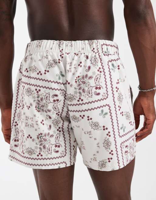 ASOS DESIGN swim shorts in short length in paisley bandana print