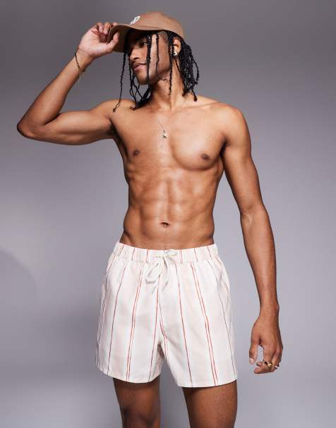 ASOS DESIGN swim shorts in short length in pink textured stripe - view 1