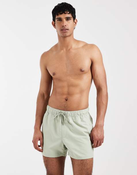 ASOS DESIGN swim shorts in short length in sage green - view 1