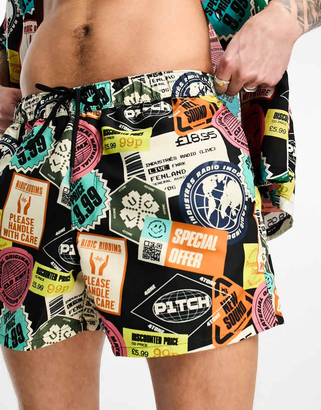 ASOS DESIGN swim shorts in short length in sticker print - part of a set