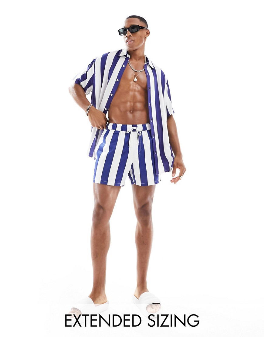 ASOS DESIGN swim shorts in short length in white and navy stripe