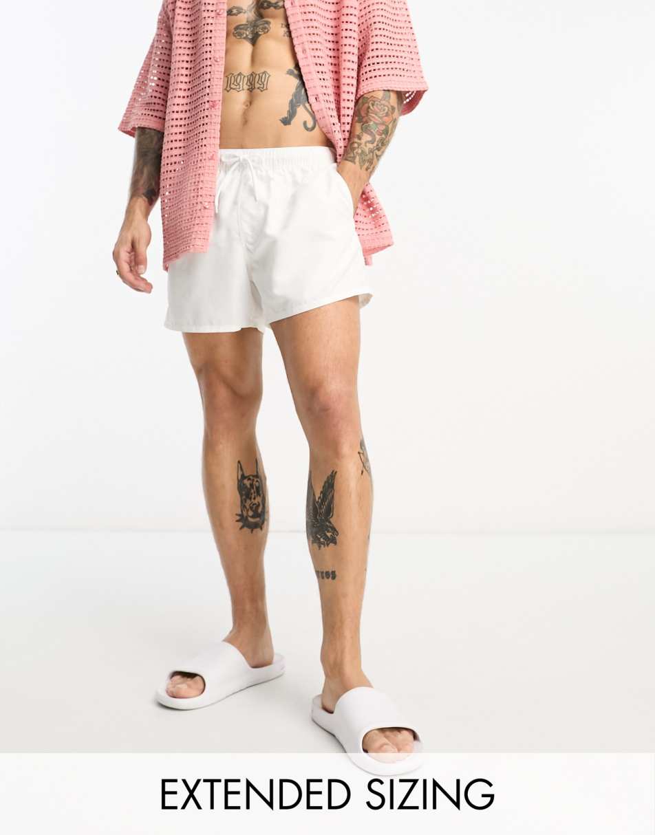 ASOS DESIGN swim shorts in short length in white