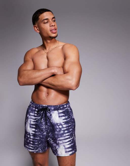 ASOS DESIGN swim shorts in short length with animal print in navy and white