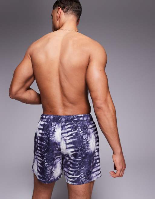 ASOS DESIGN swim shorts in short length with animal print in navy, 4 of 4
