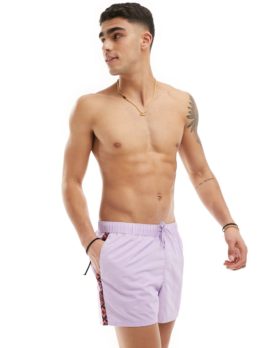 ASOS DESIGN swim shorts in short length with aztec side stripe in purple