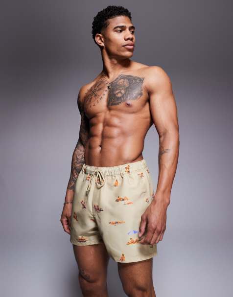 ASOS DESIGN swim shorts in short length with beach print in stone - view 1