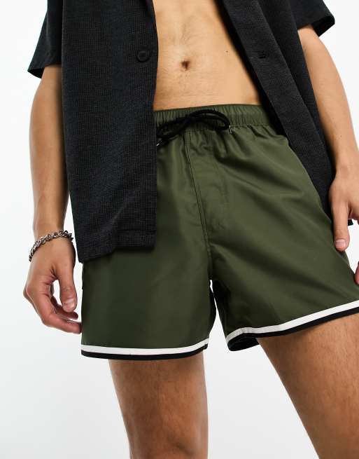 ASOS DESIGN swim shorts in short length with cargo pocket and contrast binding in khaki, 3 of 4