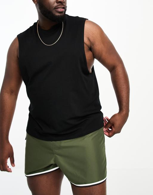 ASOS DESIGN swim shorts in short length with cargo pocket and contrast binding in khaki, 4 of 4