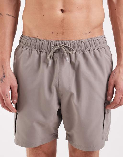 ASOS DESIGN swim shorts in short length with cargo pockets in beige, 4 of 5